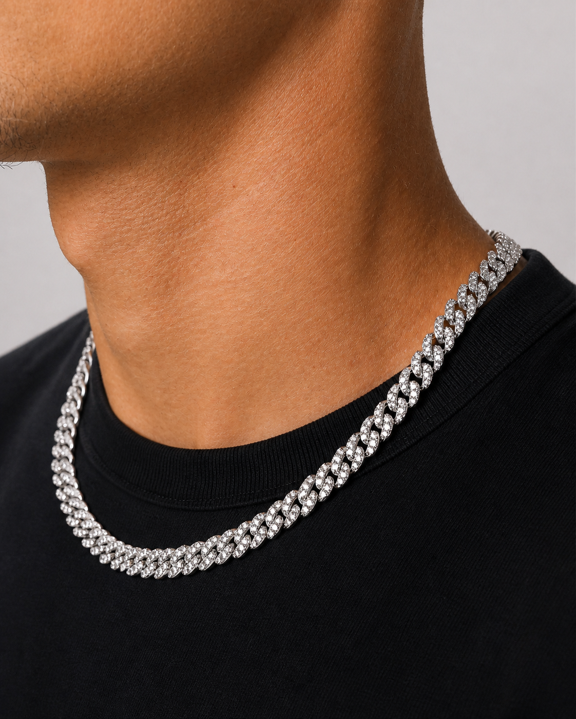Iced Cubana Chain 8 mm in 925 sterling silver worn by a male model, angled view