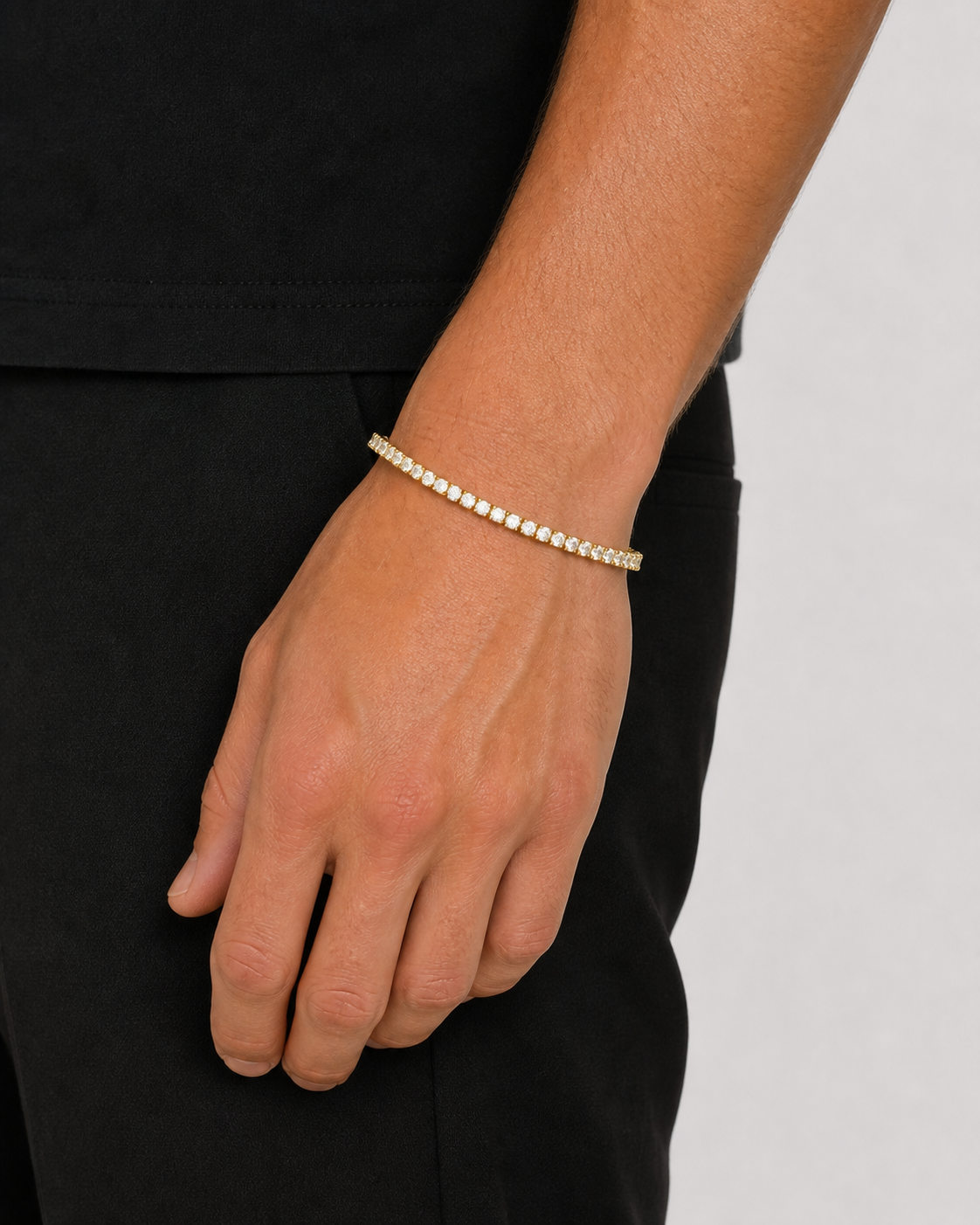 Gold Iced Tennis Bracelet 3 mm worn by Tyler with his hand relaxed