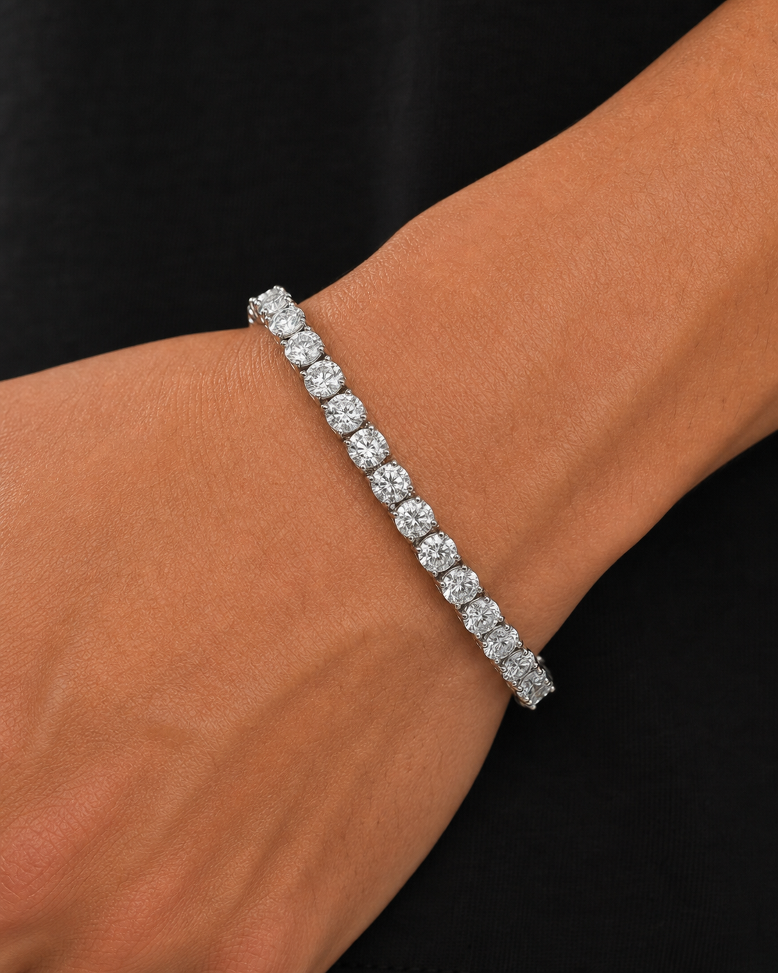 Silver Iced Tennis Bracelet 4 mm worn on Tyler's wrist in an oblique macro close-up