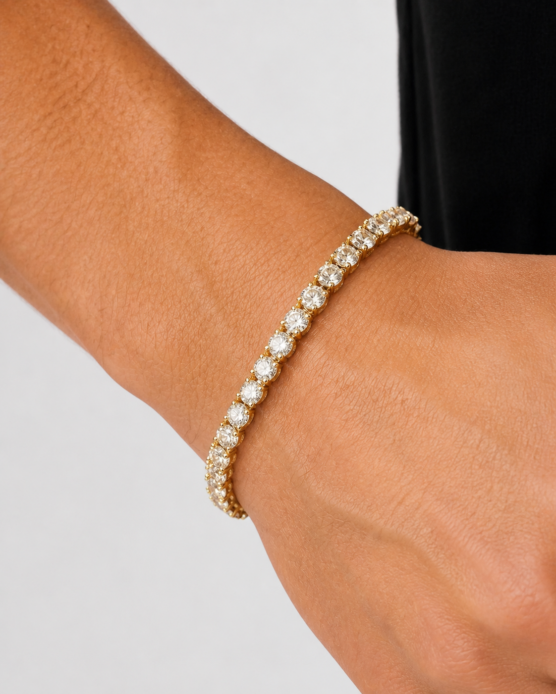 Gold Iced Tennis Bracelet 5 mm worn on a male model, close wrist view