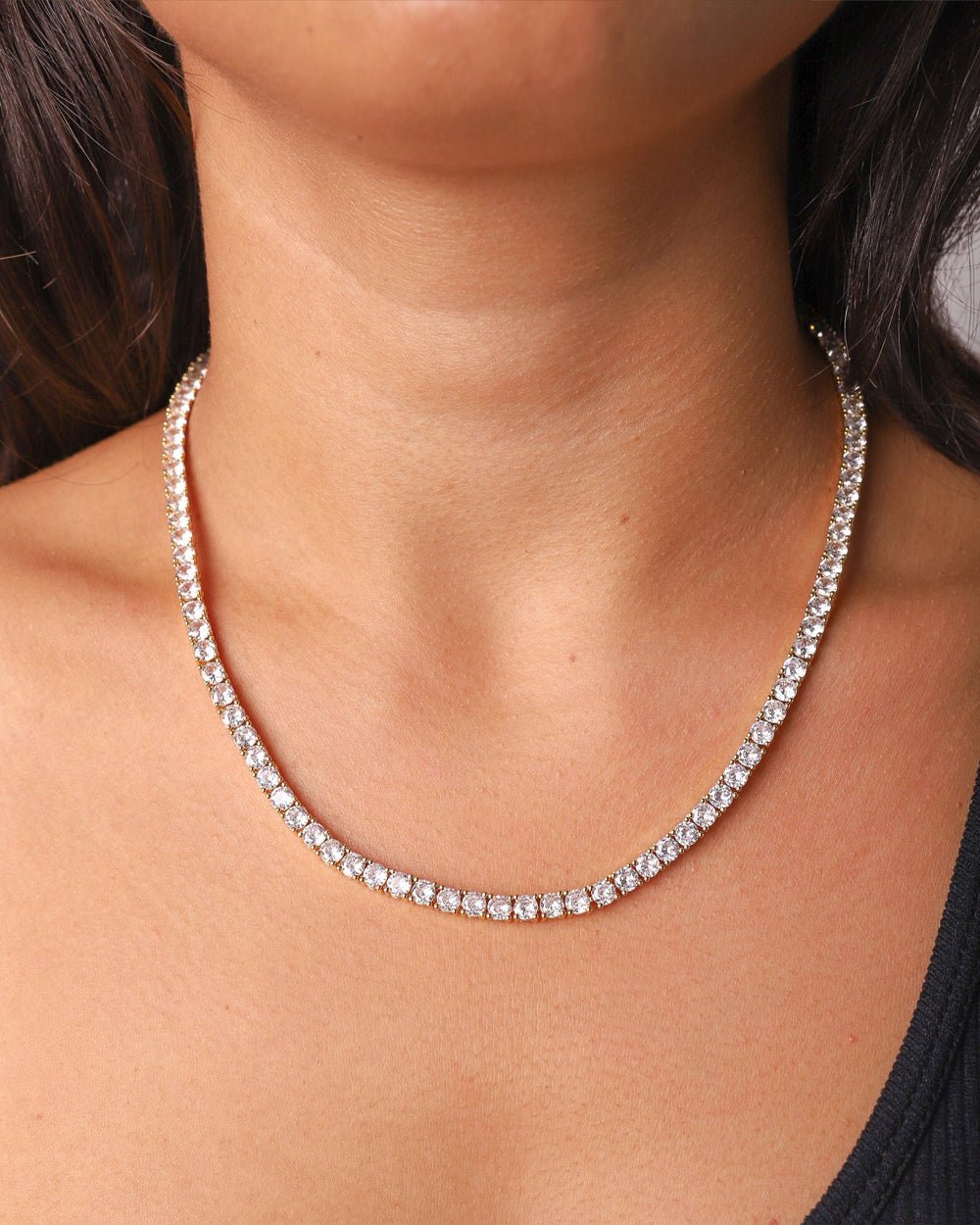 Gold Iced Tennis Chain 4 mm worn by a female model, front view