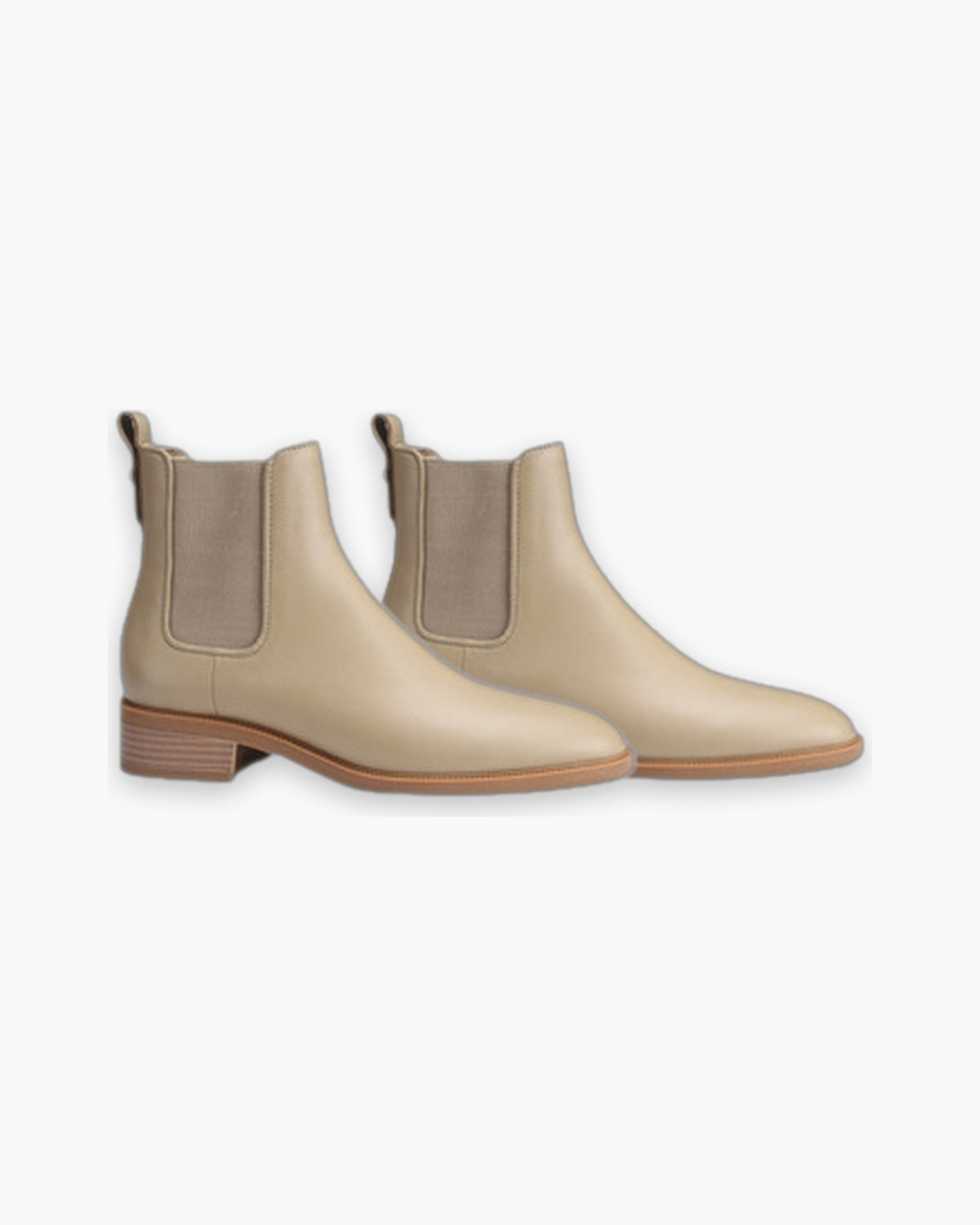 Pair of milk tea leather Chelsea boots on a plain background