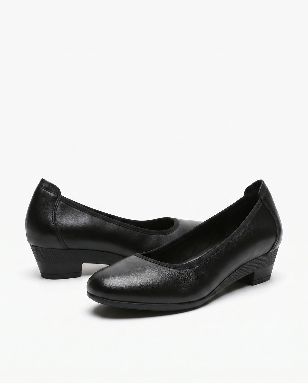 Black leather block heels with a 3.5 cm square heel, round toe and rubber sole, studio product shot