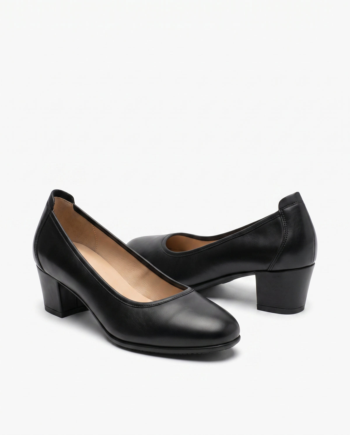 Black leather block heels with a 5 cm square heel, round toe and rubber sole, studio product shot
