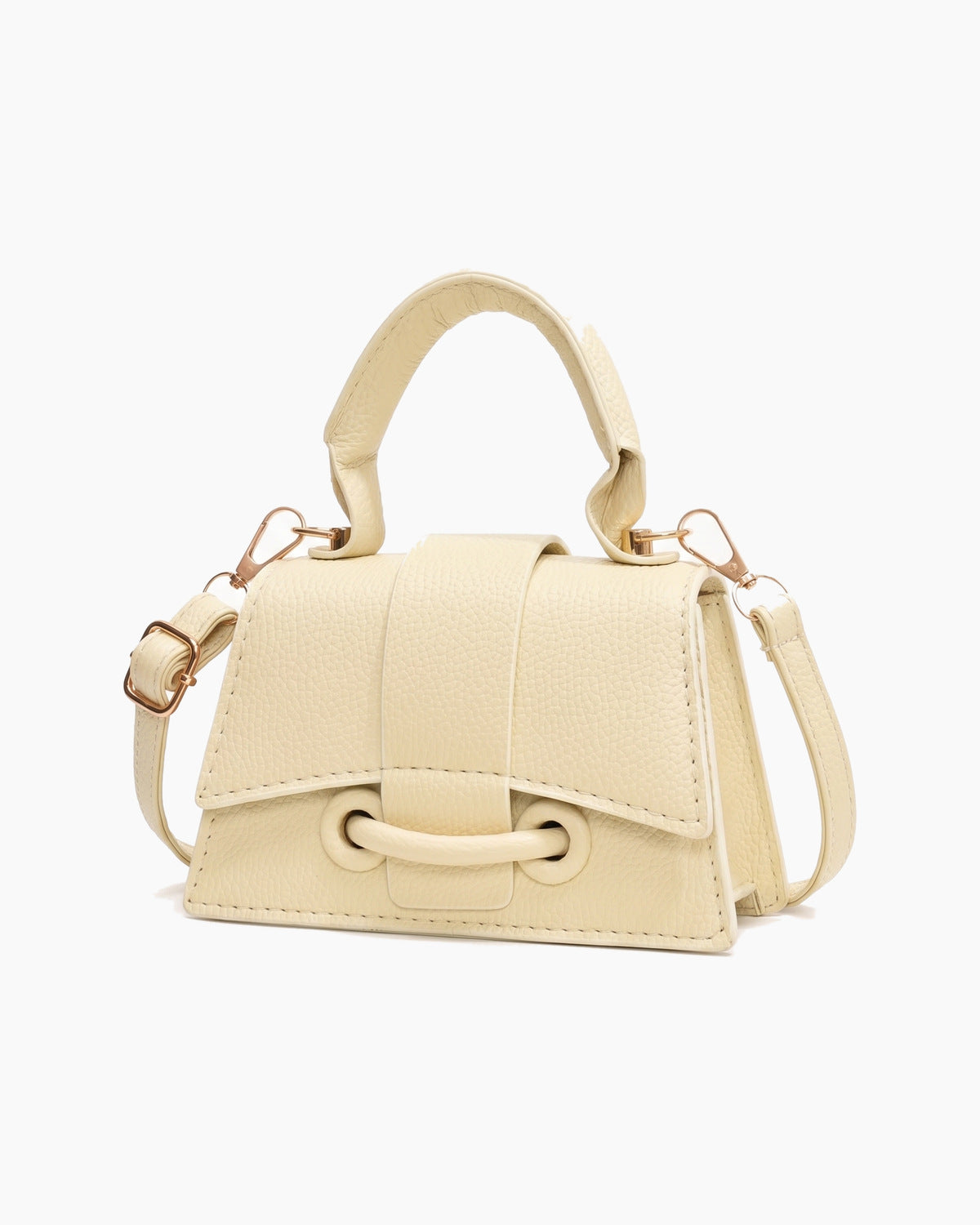 Cream mini top handle bag turned to show its side, on a plain background