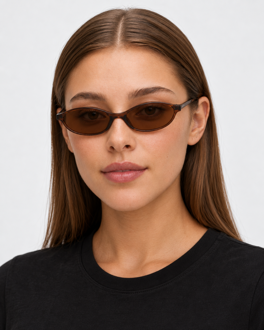 Oval Sunglasses in translucent brown with brown lenses, worn by a woman