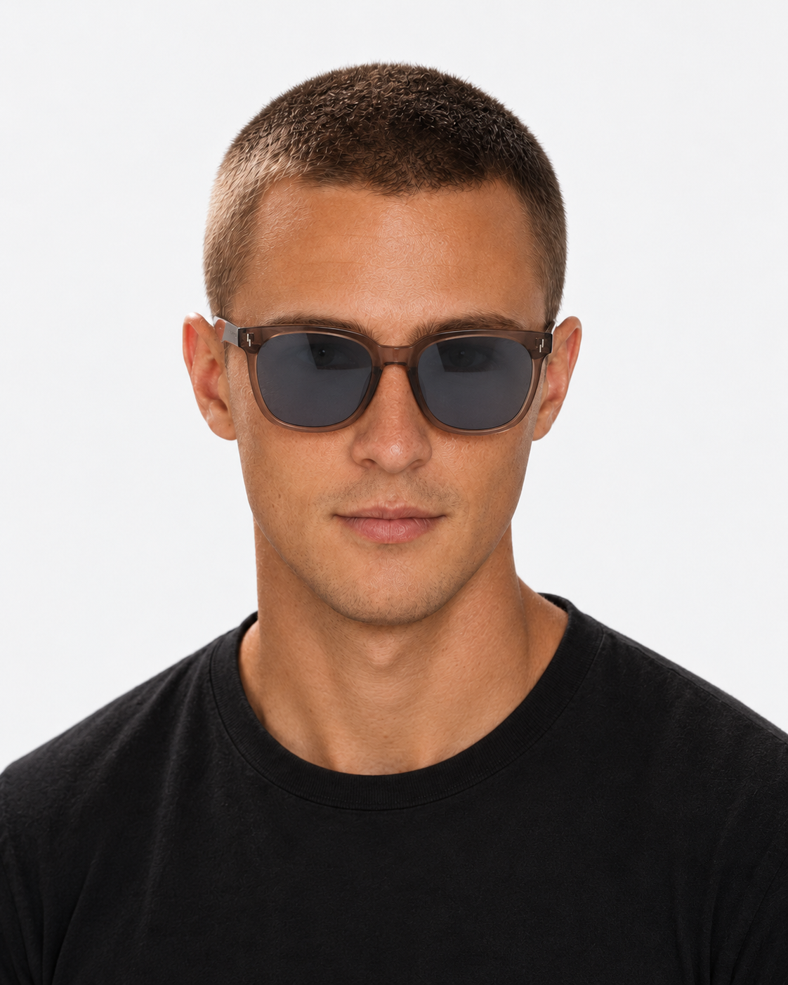 Oversized Square Sunglasses with a translucent brown frame and grey lenses, worn by a man