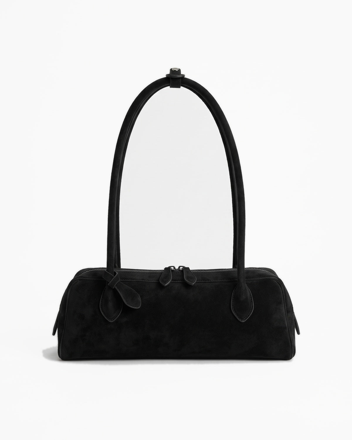Black suede baguette bag with a top zip and twin short straps, on a plain background