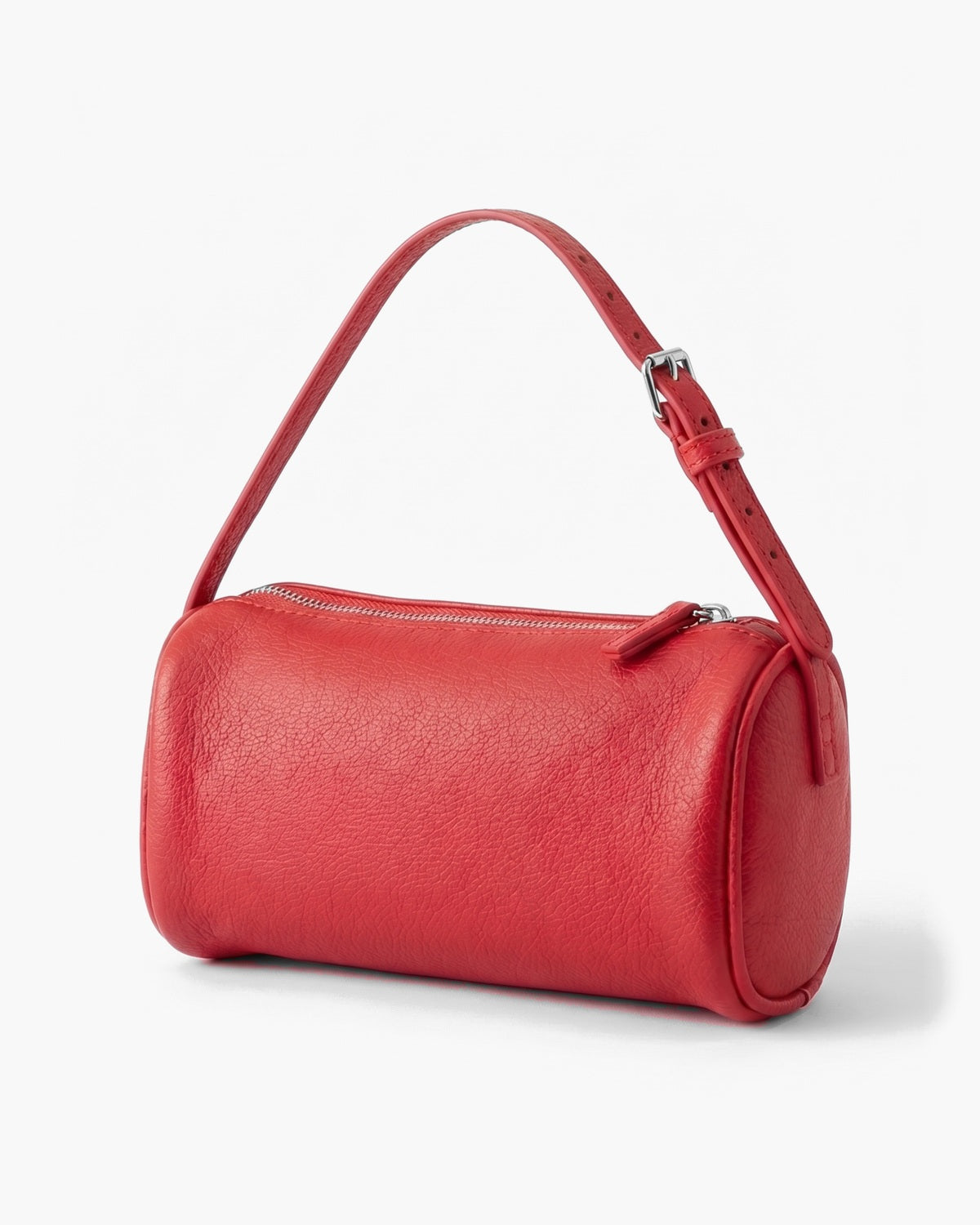 Red barrel-shaped crossbody bag with a full length top zip and an adjustable buckle strap, on a plain background