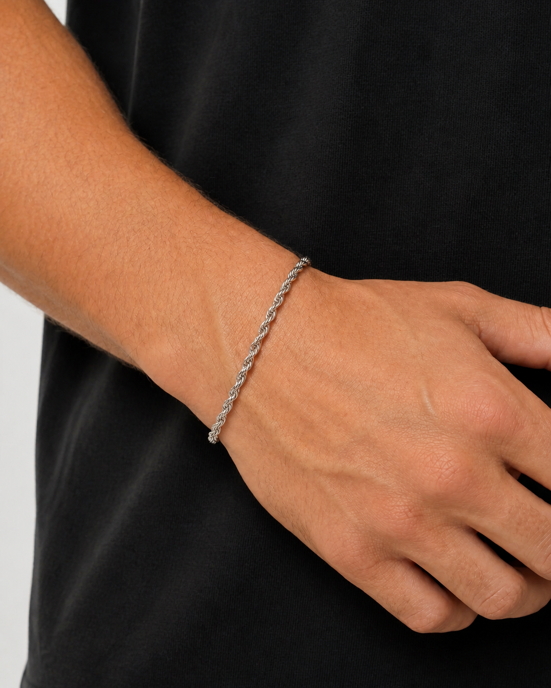Silver 3 mm rope bracelet worn on Tyler's wrist
