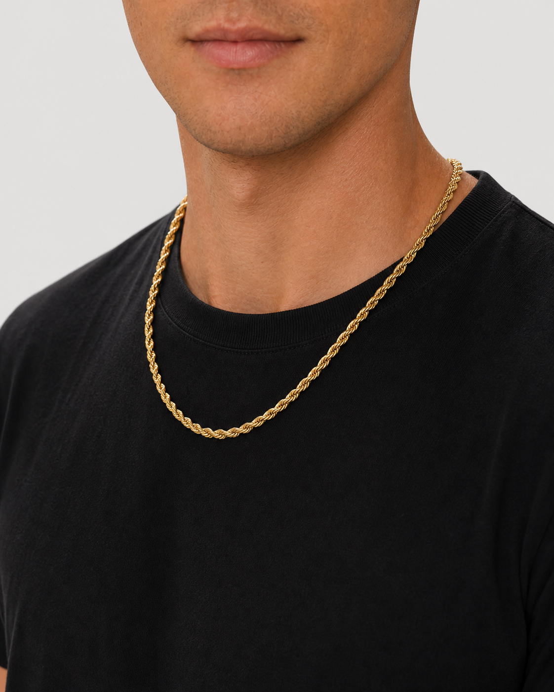 Gold 5 mm rope chain worn from a three-quarter neckline angle