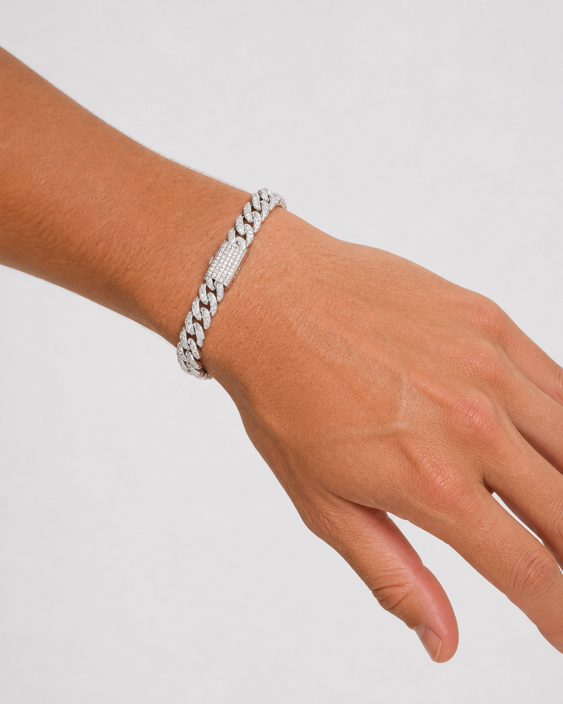 Iced Cubana Bracelet 8 mm in 925 sterling silver worn by a male model, angled wrist close-up