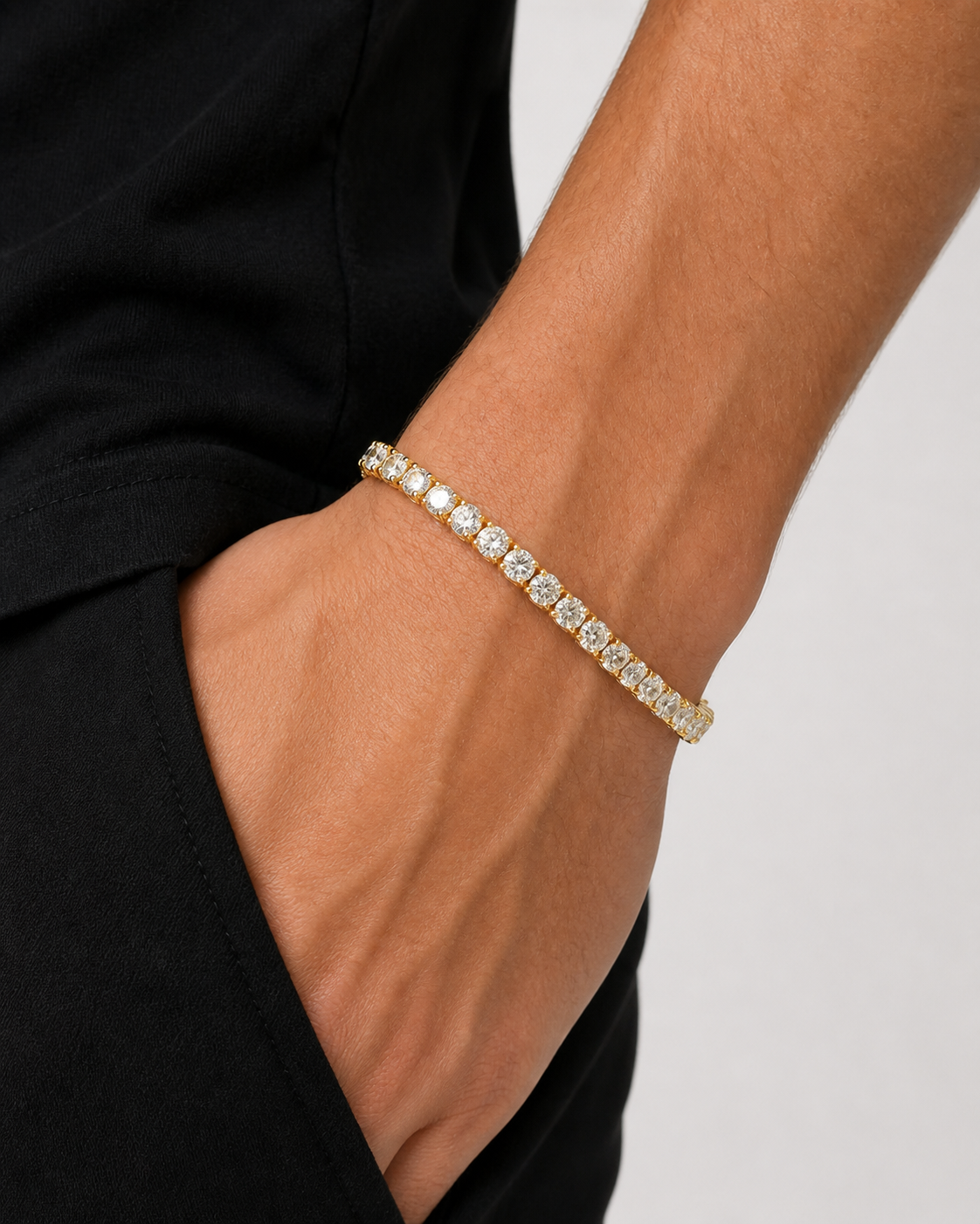 Gold Iced Tennis Bracelet 5 mm worn on a male model, three-quarter wrist close-up