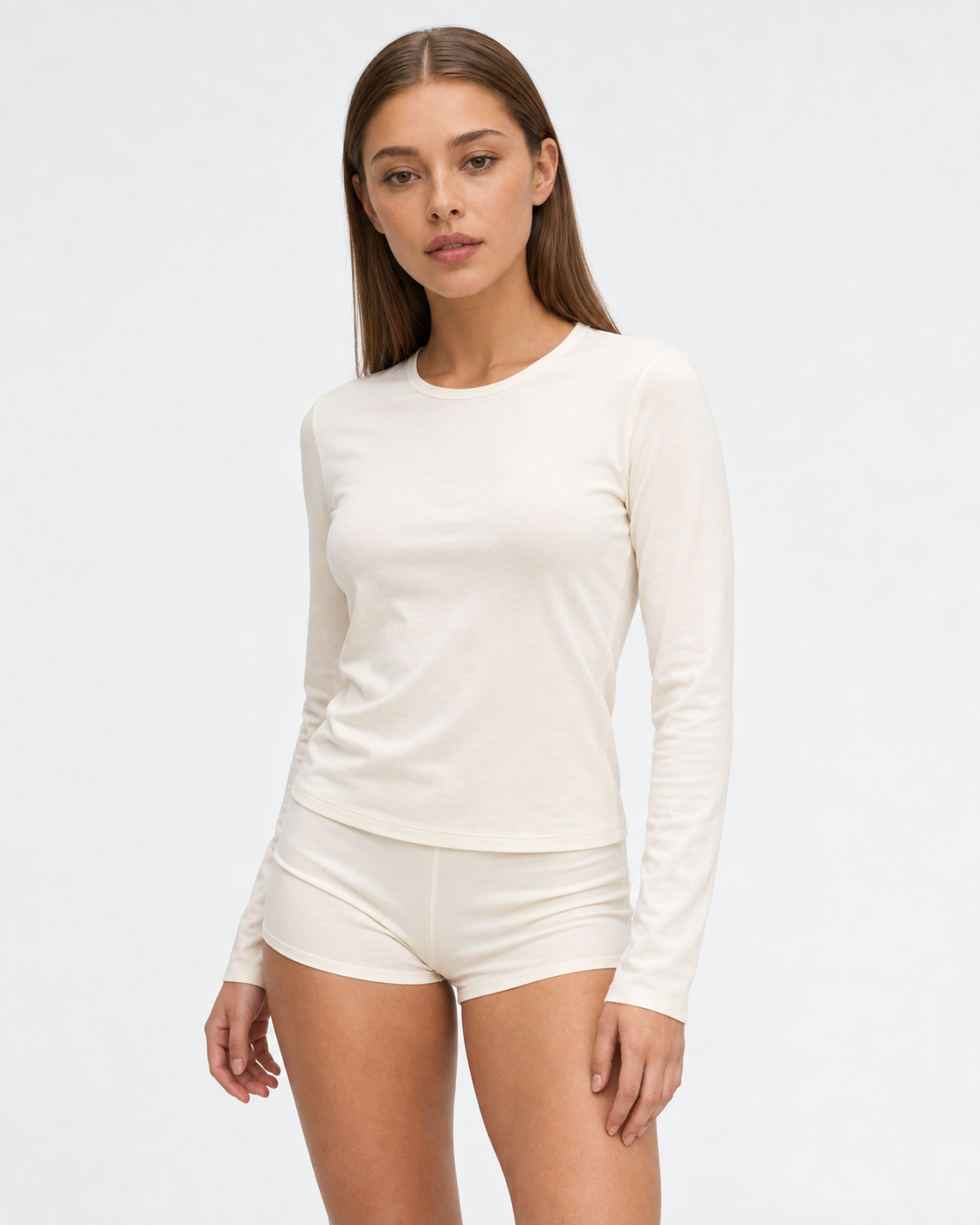 Sara wearing the Jersey Sleep Set in off white, closer front view