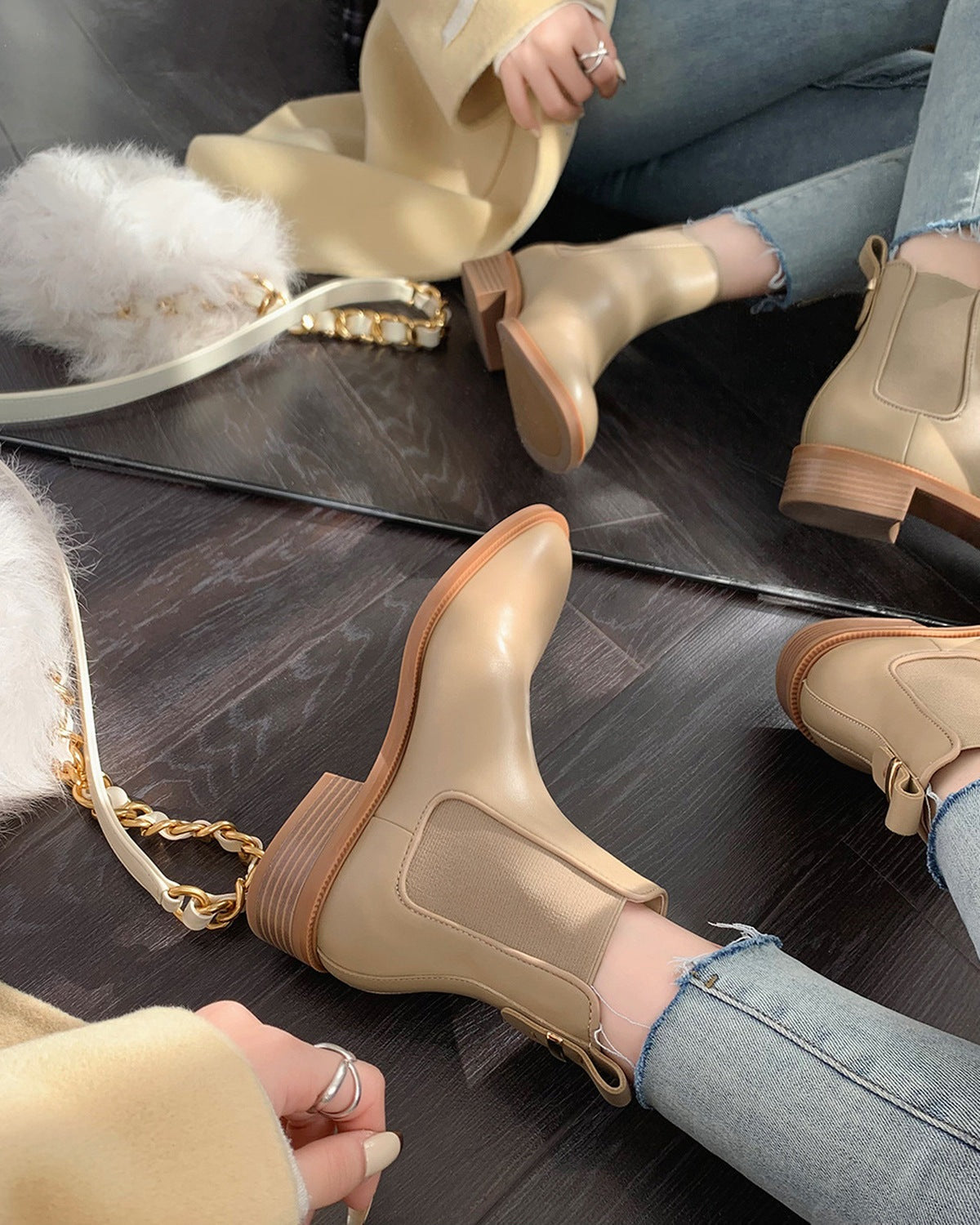 Black Chelsea boots worn with cropped jeans