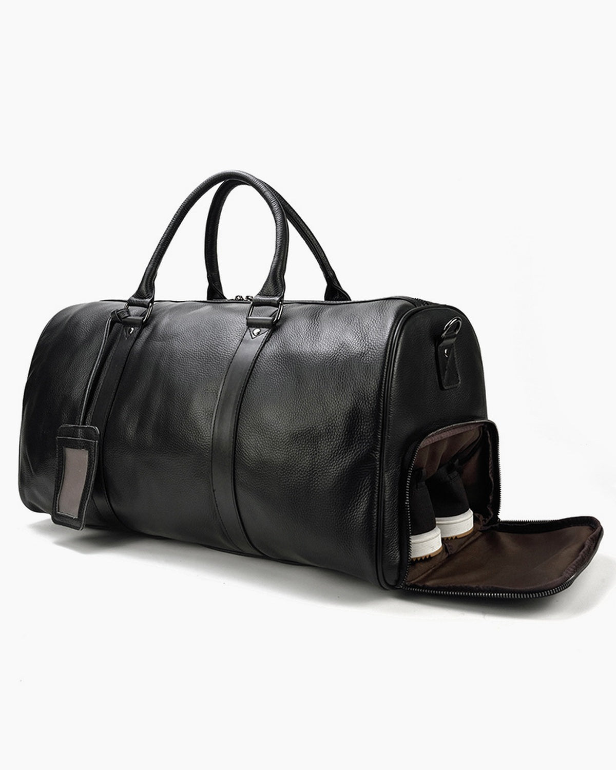 Black leather weekender bag with the end shoe compartment unzipped and open, on a plain background