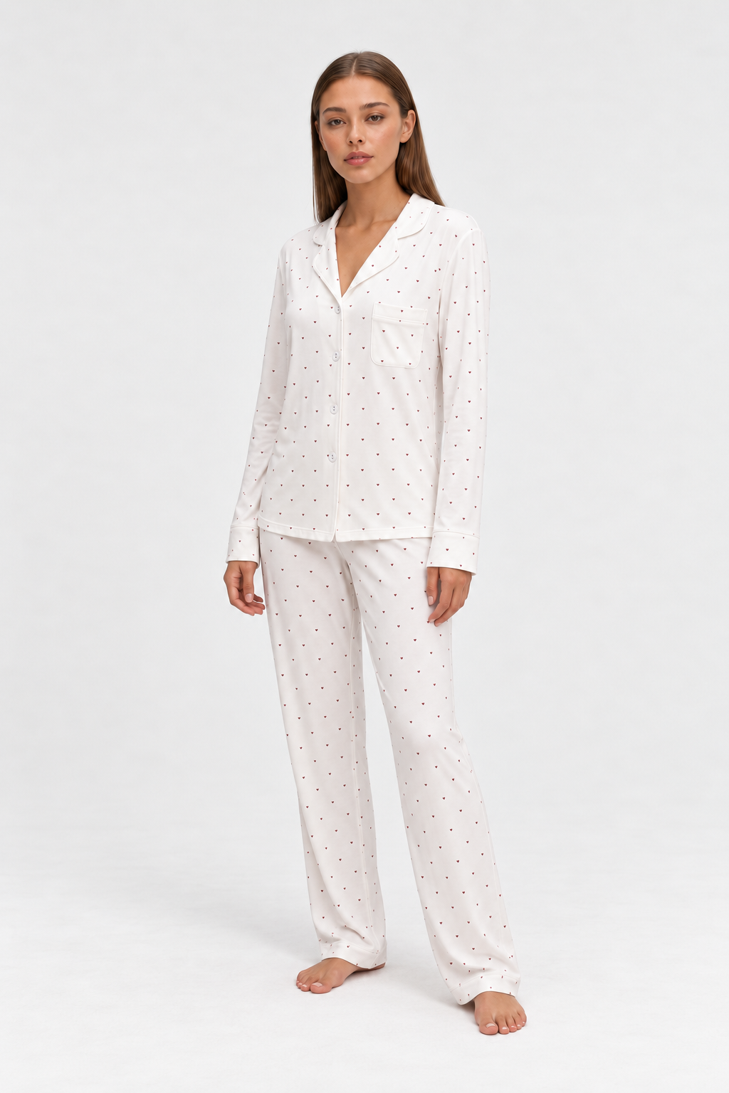 long heart print pajama set white worn by Sarah in a full-length studio view