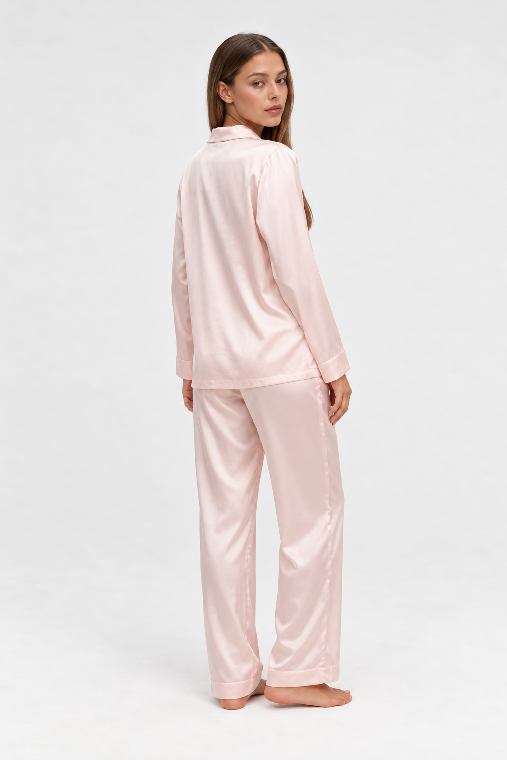 long silk pajama set pink worn by Sarah in a full-length studio view