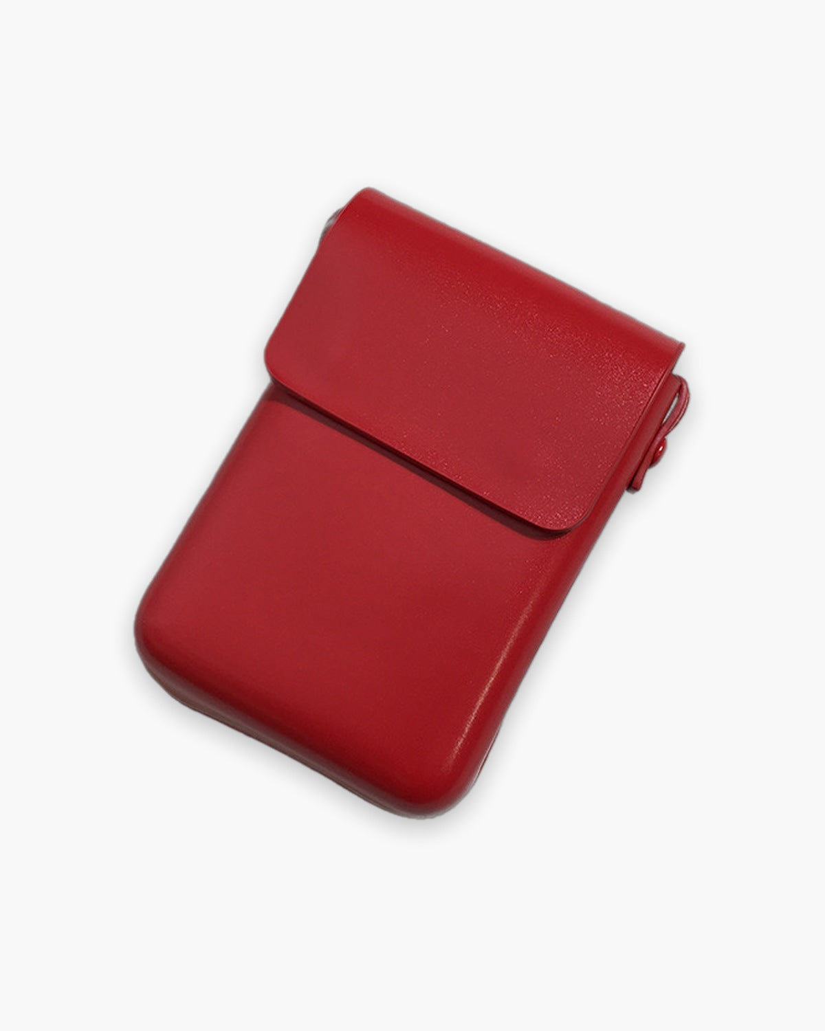 Red mini crossbody bag with a short front flap, on a plain background