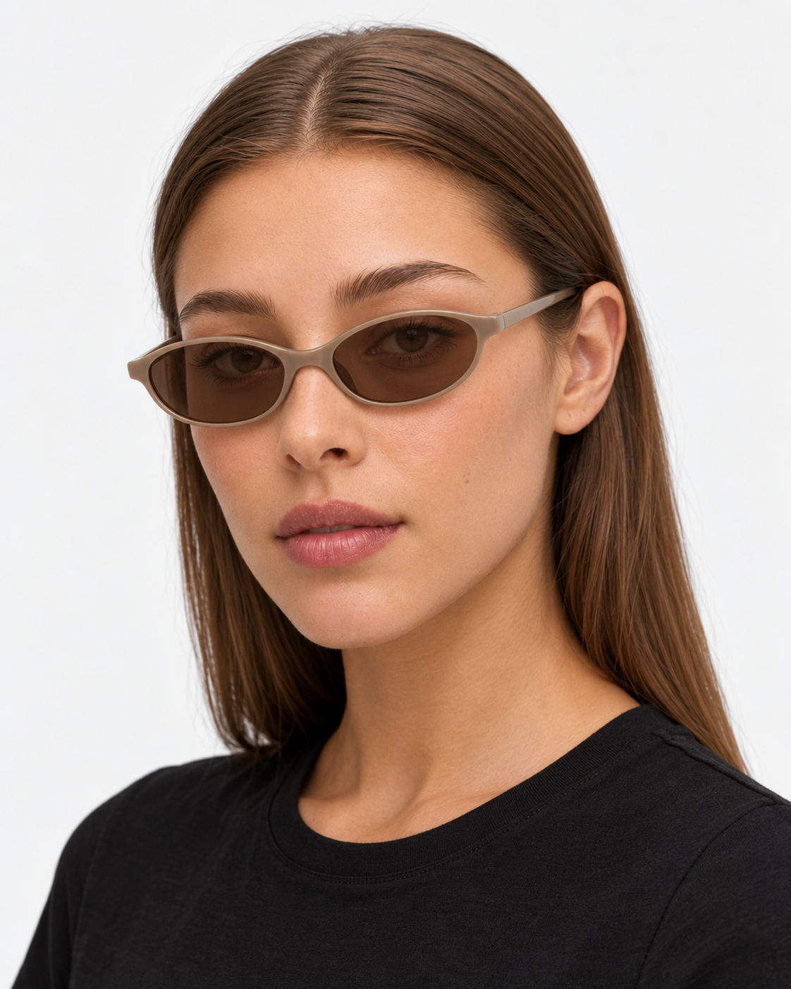 Oval Sunglasses in taupe with brown lenses, worn by a woman