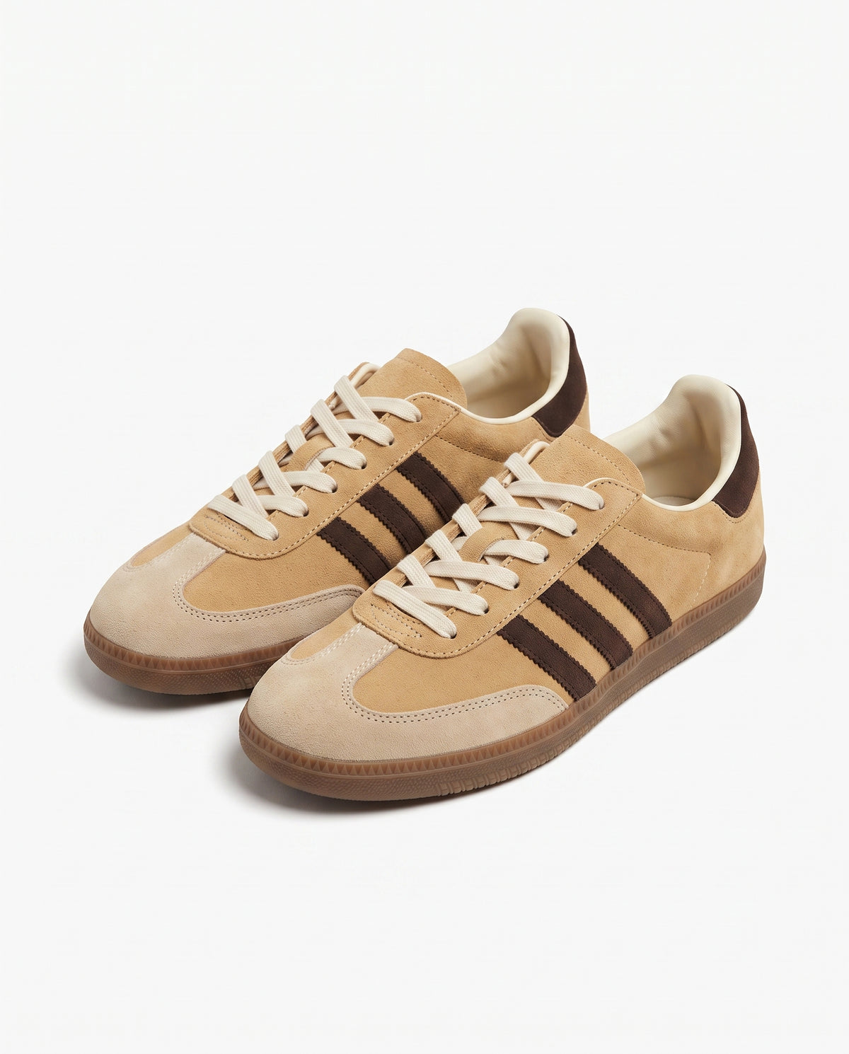 Camel suede retro low top sneaker with three dark brown side stripes and brown gum sole, studio product shot