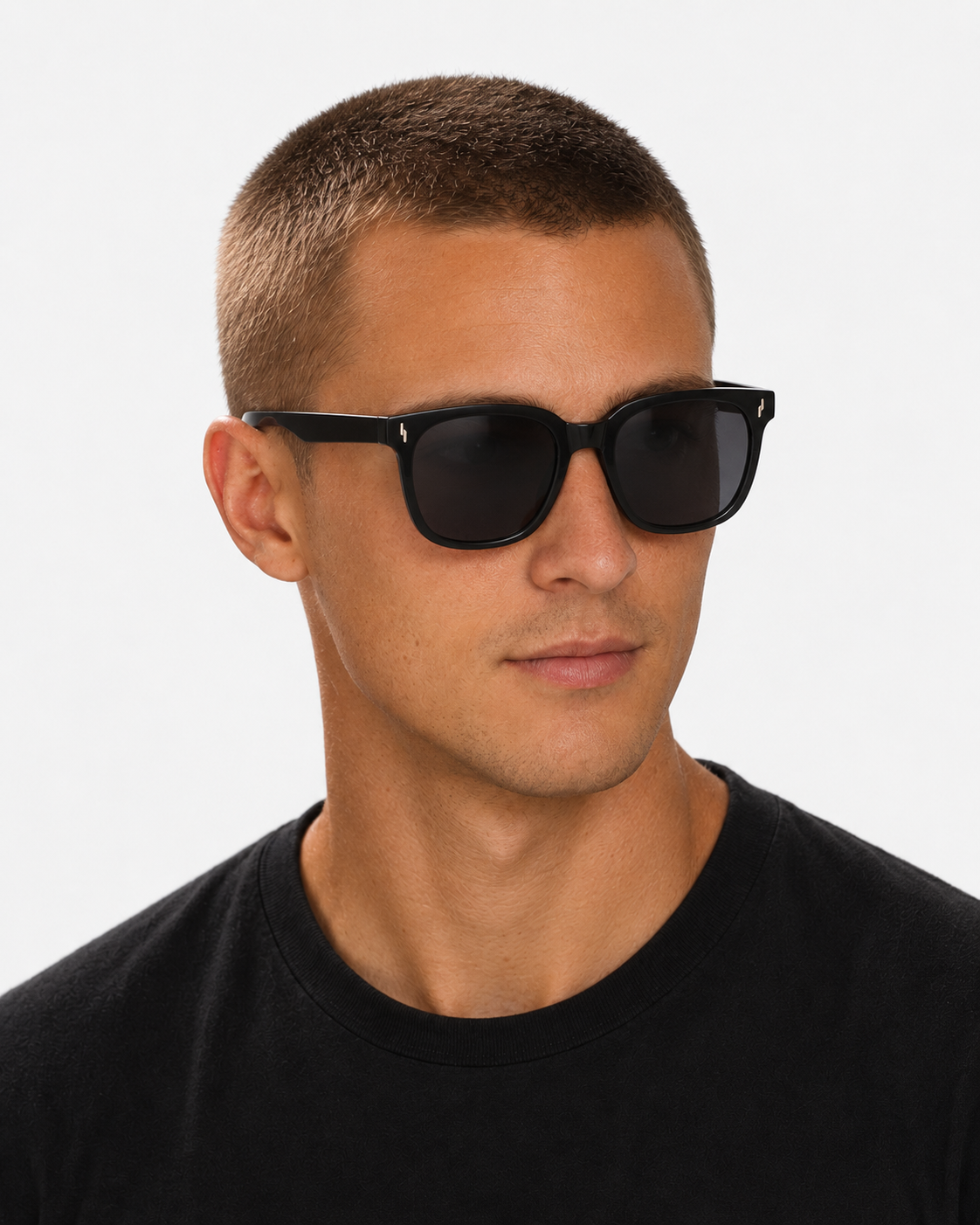 Oversized Square Sunglasses with a gloss black frame and grey lenses, worn by a man