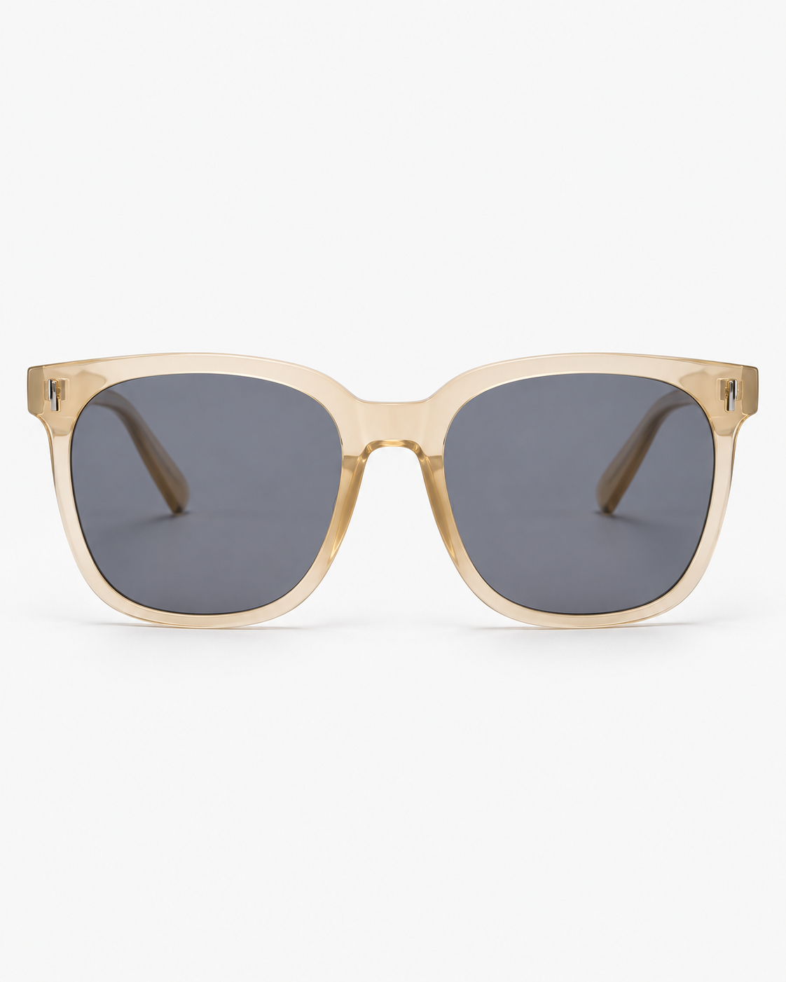 Oversized Square Sunglasses with a translucent champagne frame and grey lenses, front view