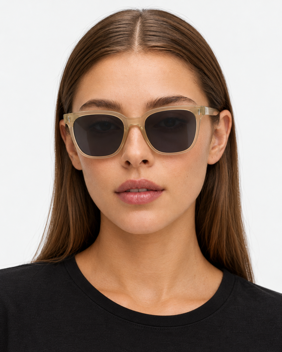 Oversized Square Sunglasses with a translucent champagne frame and grey lenses, worn by a woman