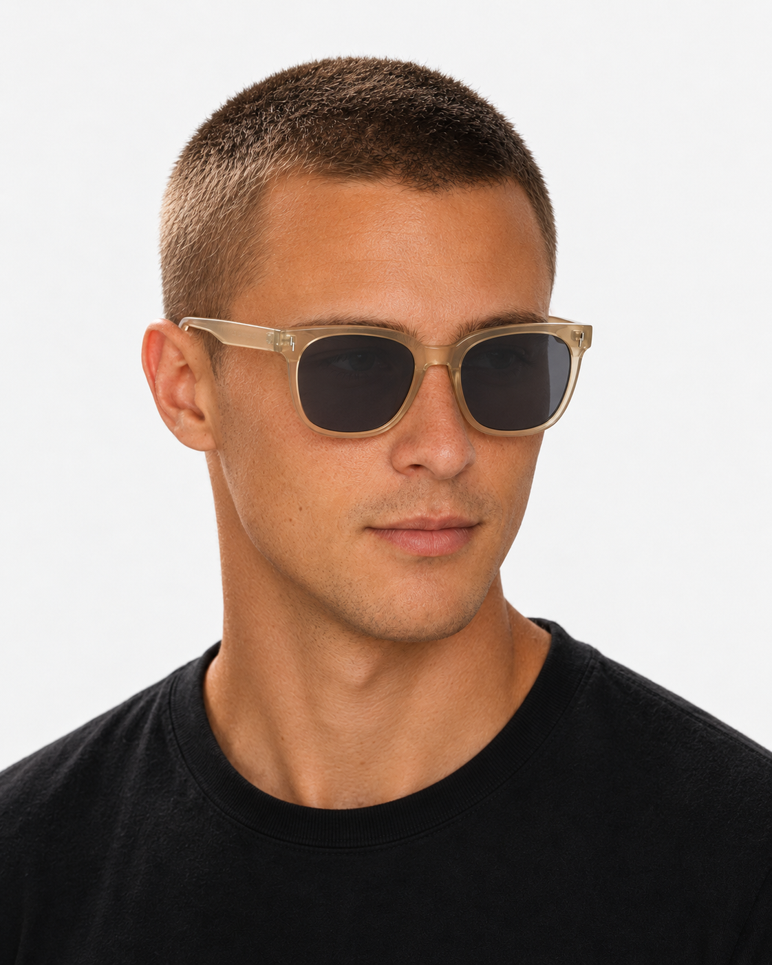 Oversized Square Sunglasses with a translucent champagne frame and grey lenses, worn by a man