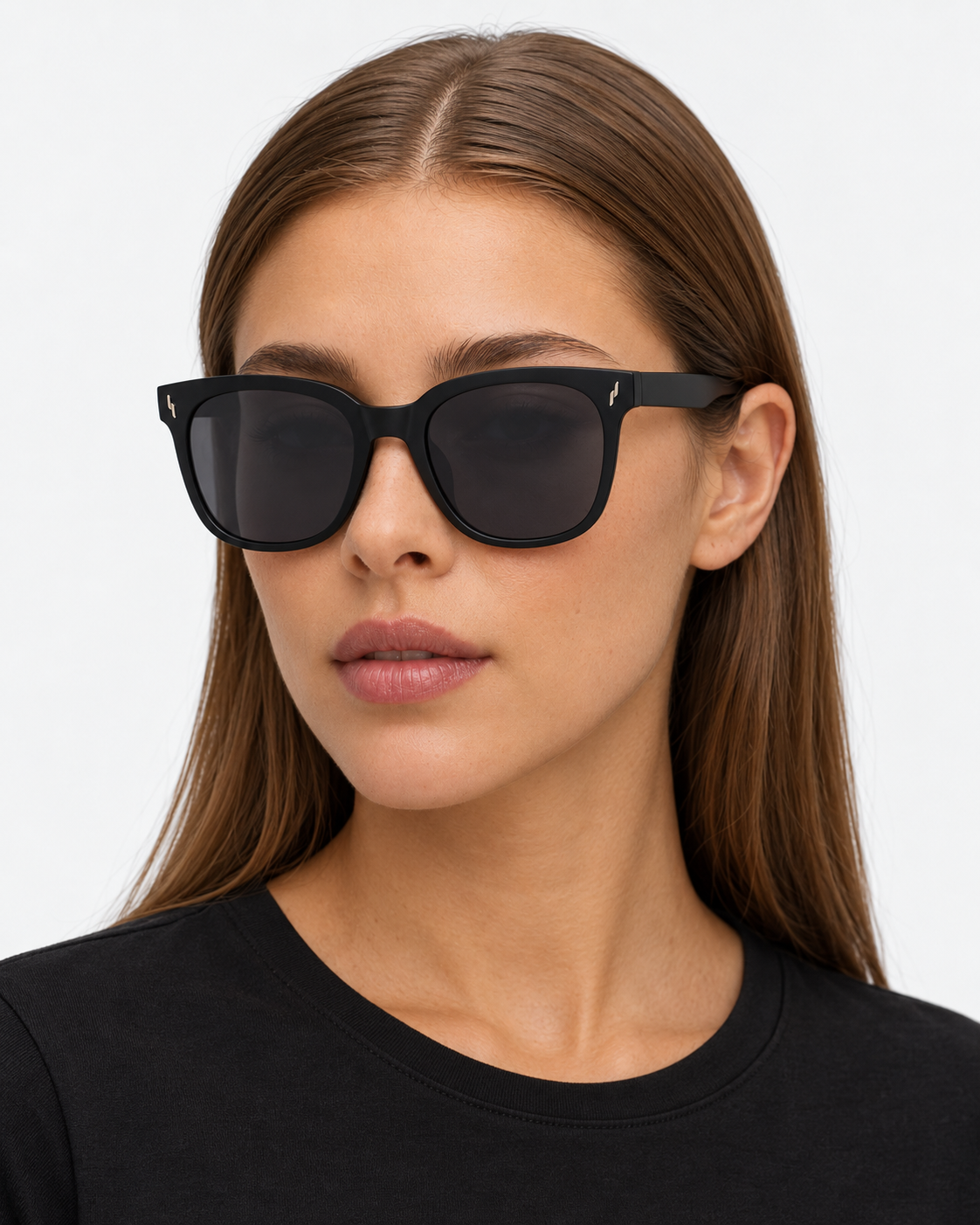 Oversized Square Sunglasses with a matte black frame and grey lenses, worn by a woman