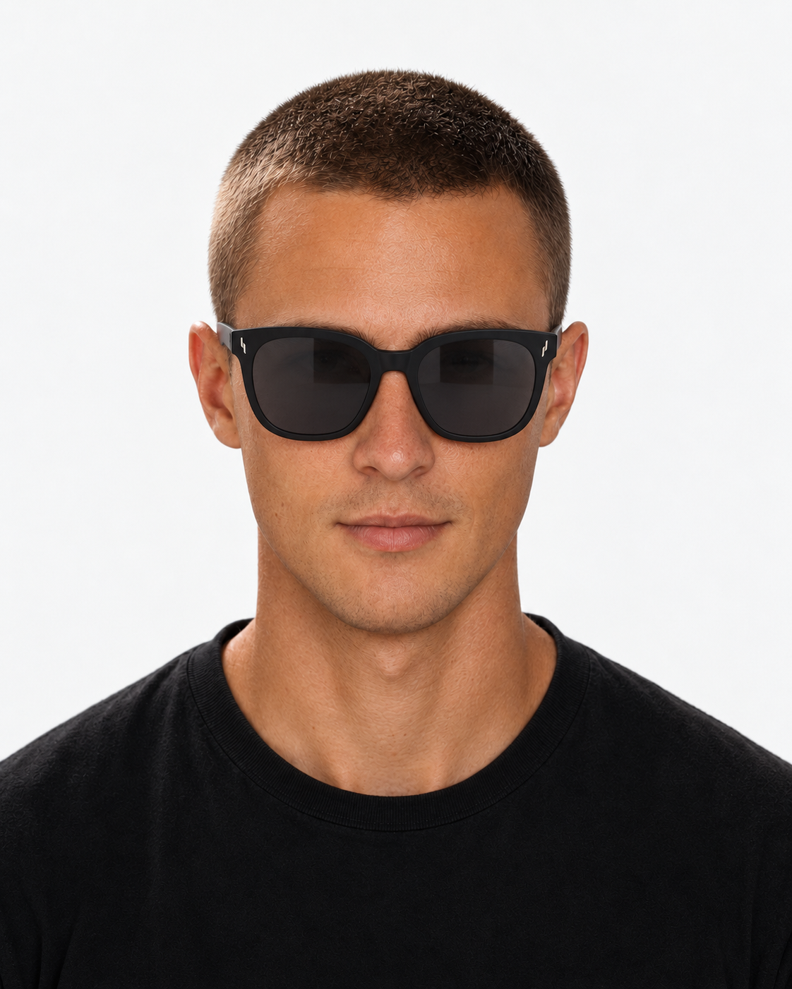 Oversized Square Sunglasses with a matte black frame and grey lenses, worn by a man