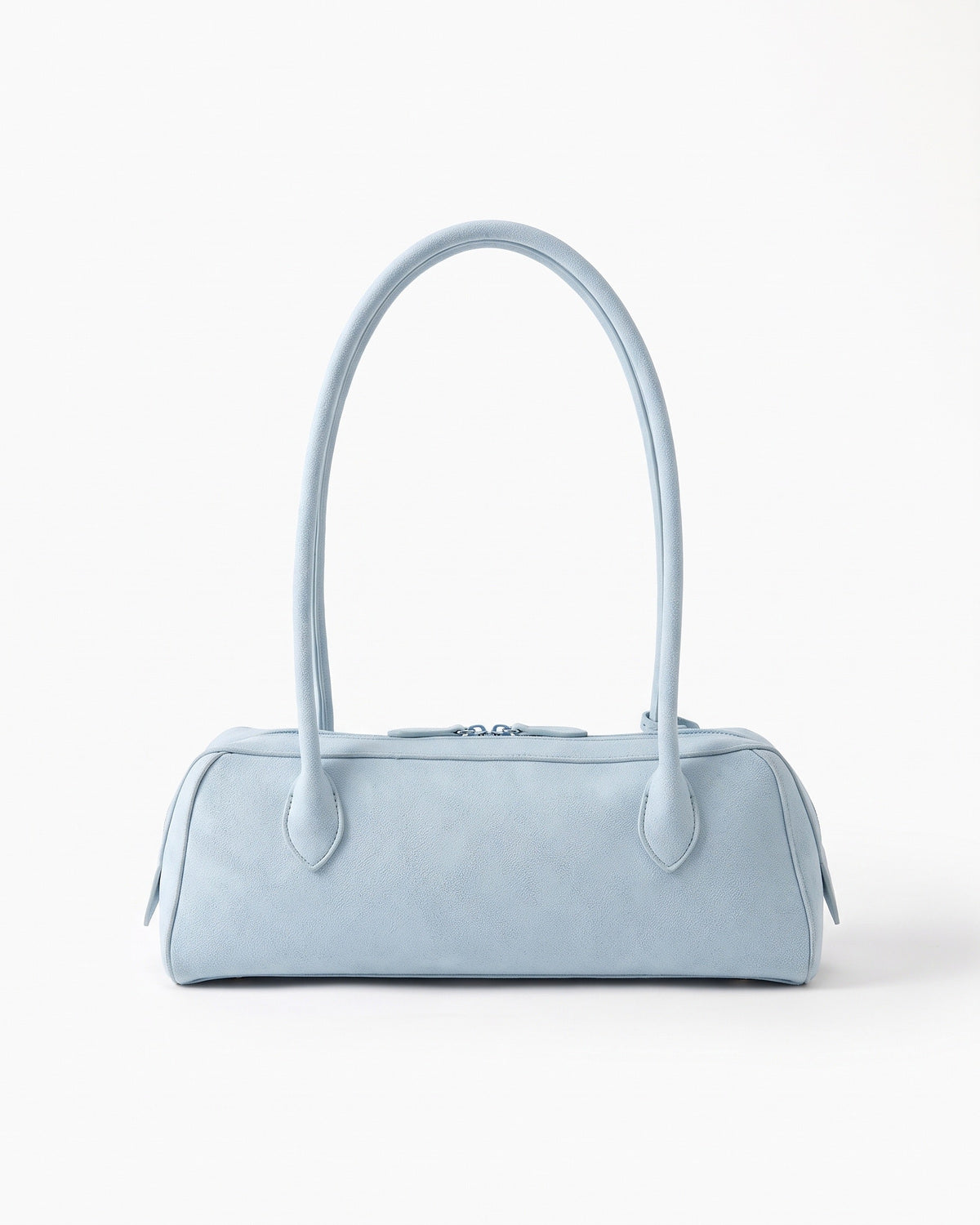 Light blue suede baguette bag with a top zip and twin short straps, on a plain background