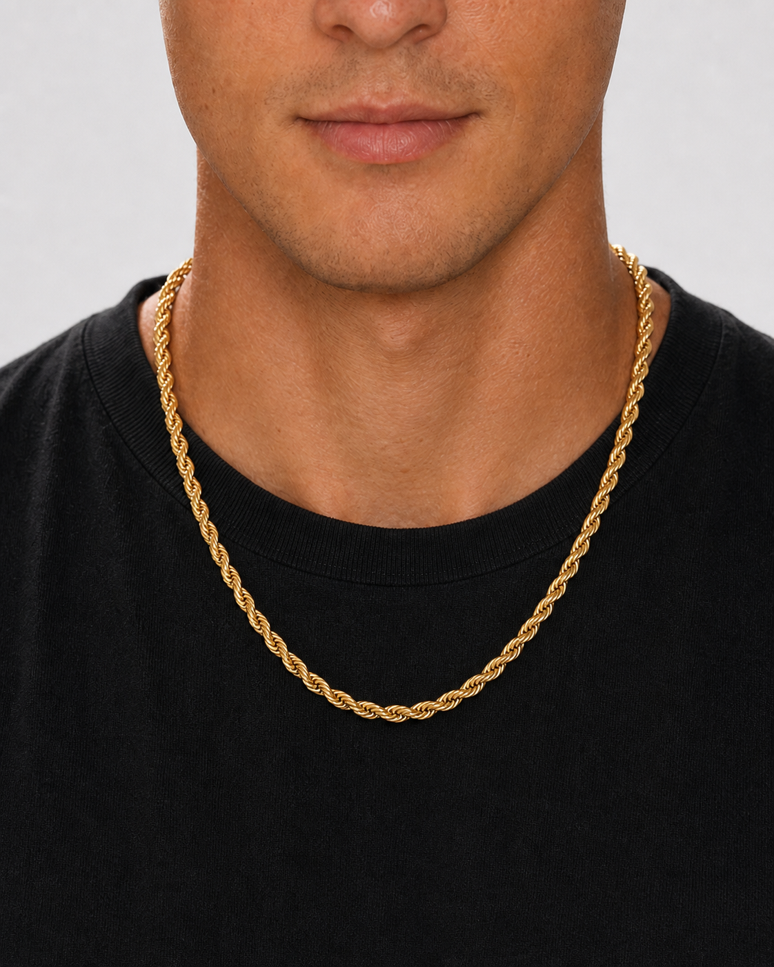 Gold 5 mm rope chain worn at the neckline with a black shirt