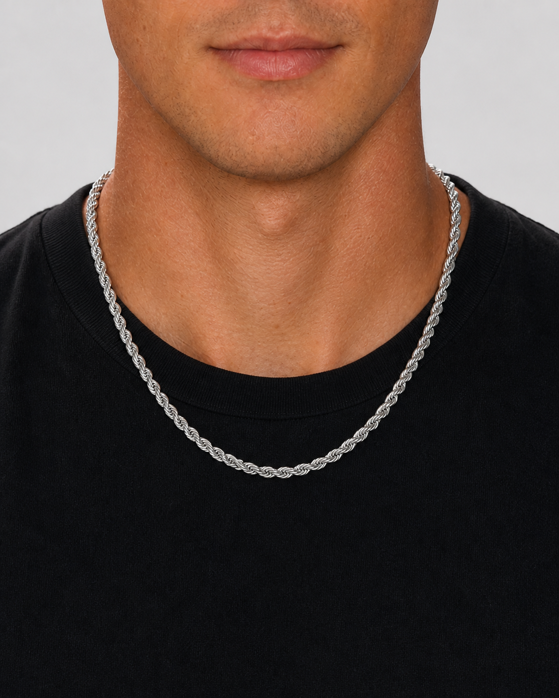 Silver 5 mm rope chain worn at the neckline with a black shirt