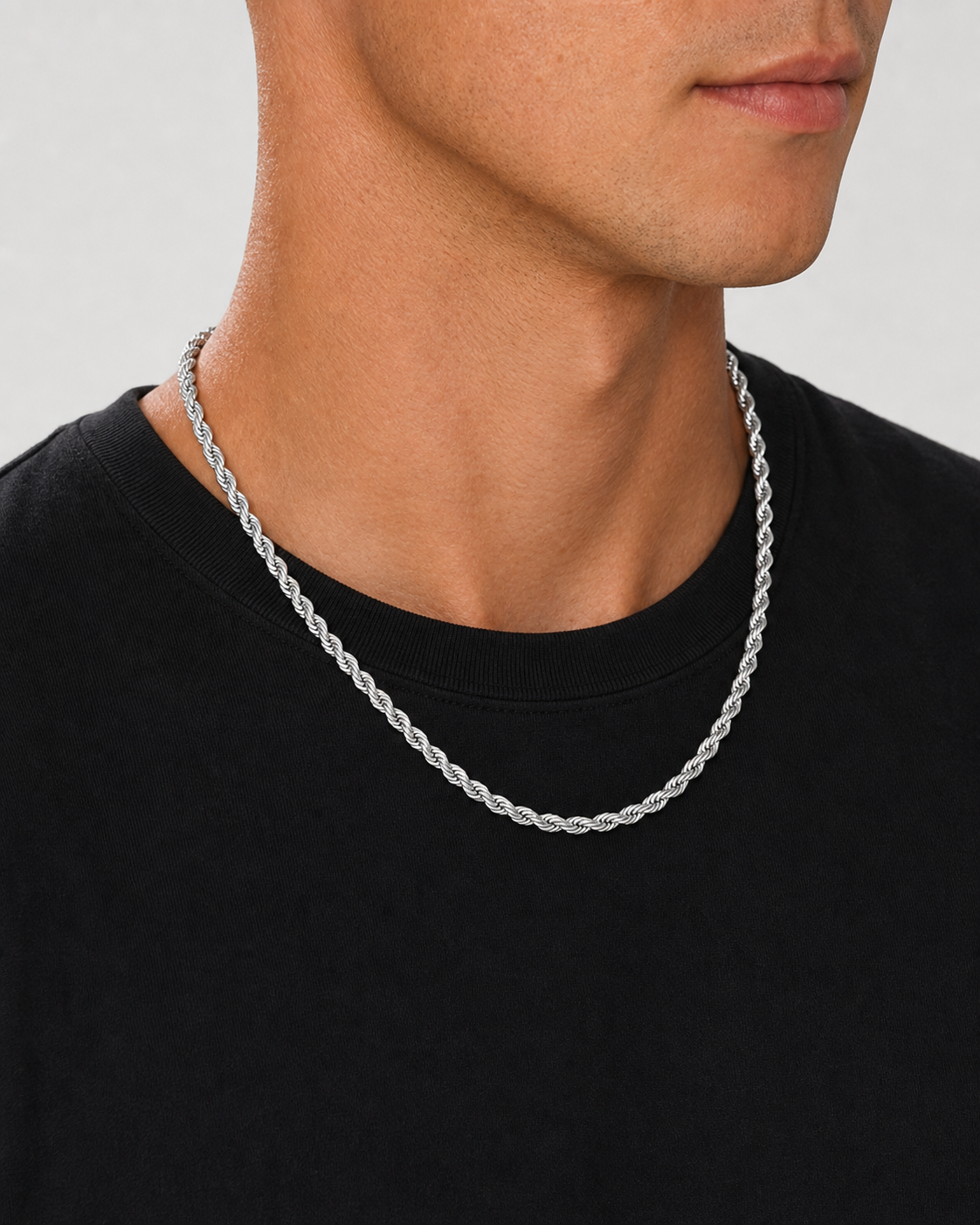 Silver 5 mm rope chain worn from a side-led neckline angle